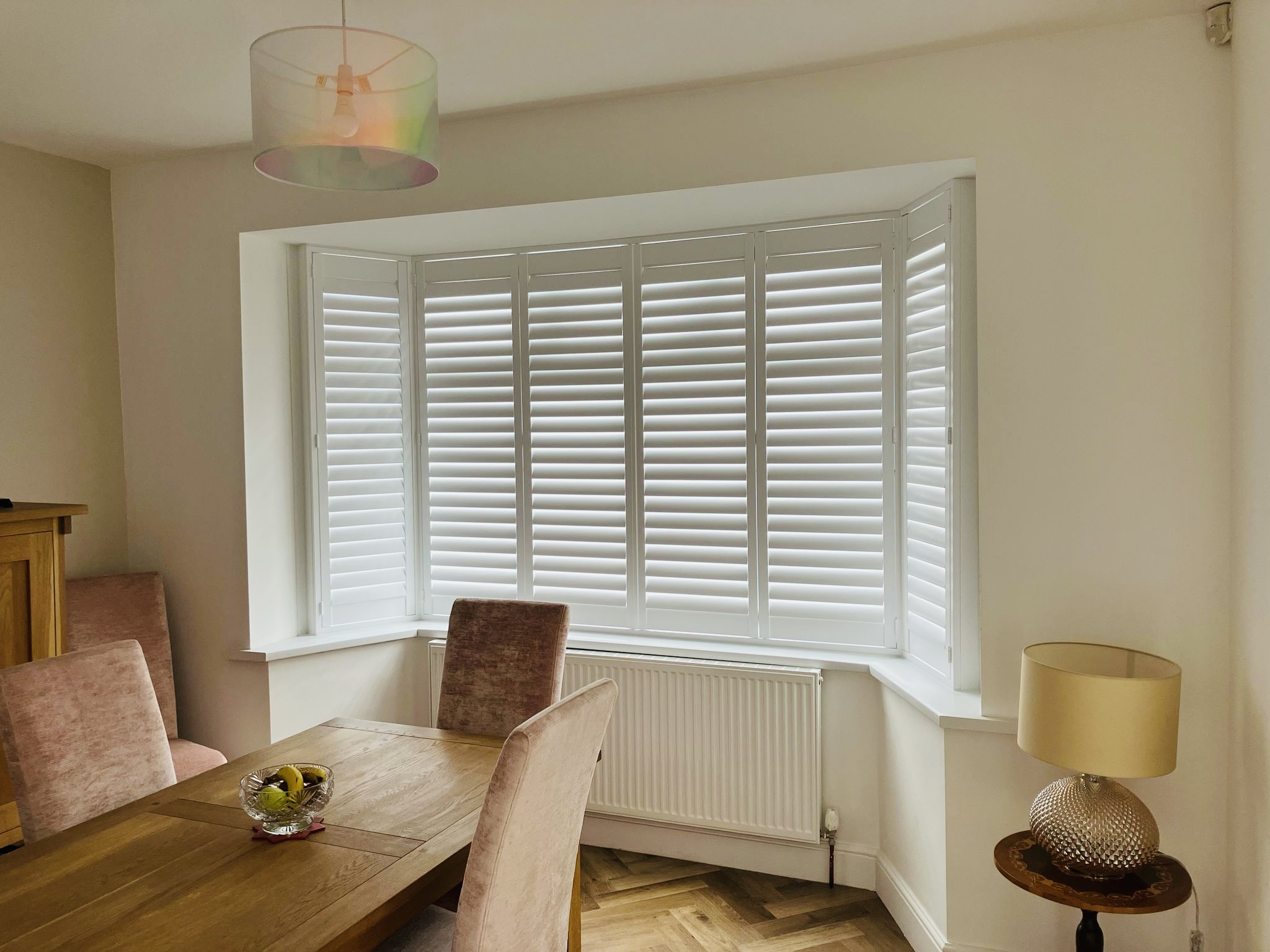 Bay window plantation shutters fitted in a Cambridgeshire home